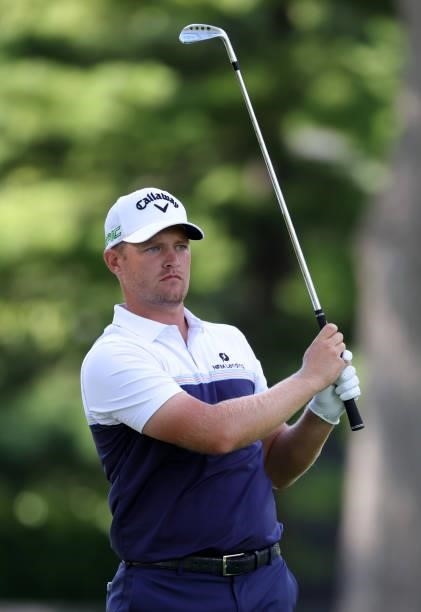 Tom Lewis of England plays his shot on the eighth hole during the second round of the Rocket Mortgage Classic on July 02, 2021 at the Detroit Golf...