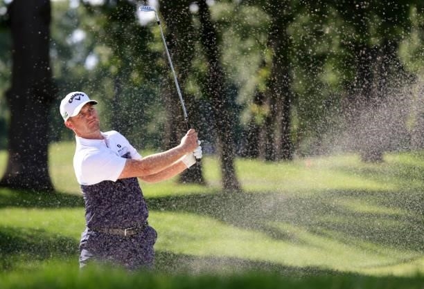 Tom Lewis of England plays a shot from a bunker on the ninth hole during the second round of the Rocket Mortgage Classic on July 02, 2021 at the...