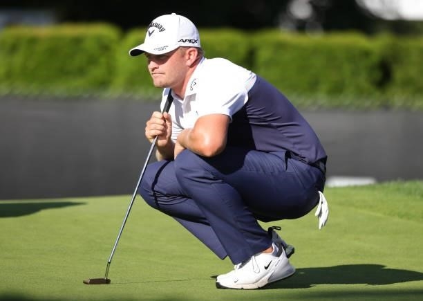 Tom Lewis of England lines up a putt on the ninth green during the second round of the Rocket Mortgage Classic on July 02, 2021 at the Detroit Golf...