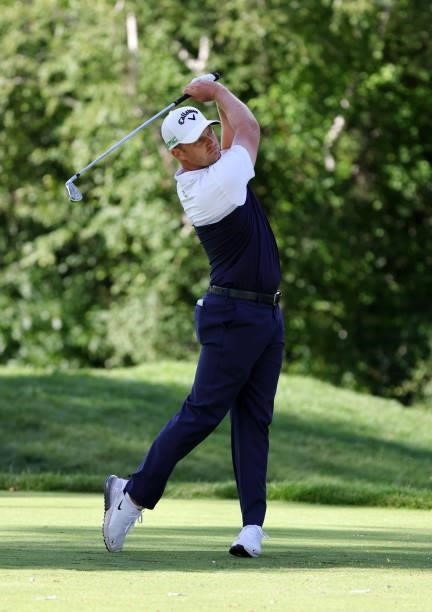 Tom Lewis of England rplays his shot from the ninth tee during the second round of the Rocket Mortgage Classic on July 02, 2021 at the Detroit Golf...