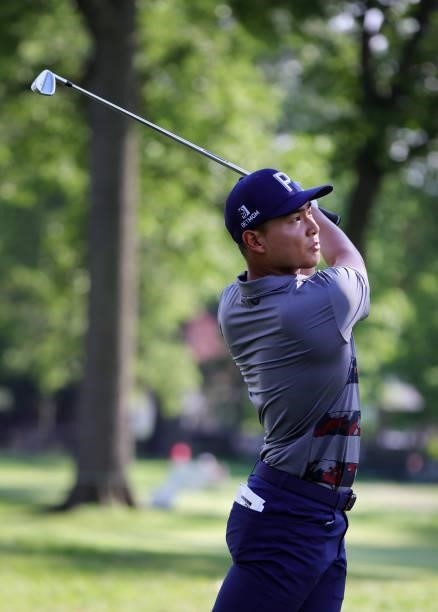 Justin Suh plays his shot from the fifth tee during the second round of the Rocket Mortgage Classic on July 02, 2021 at the Detroit Golf Club in...