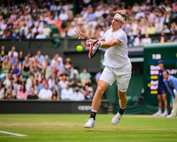 Dennis Shapovalov of Canada hits a forehand against Andy Murray of Great Britain in the third round of the gentlemen's singles during Day Five of The...