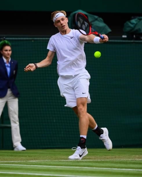Dennis Shapovalov of Canada hits a backhand against Andy Murray of Great Britain in the third round of the gentlemen's singles during Day Five of The...