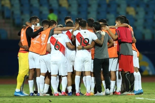 Players of Peru huddle as they celebrate winning the match in a penalty shootout after a quarterfinal match between Peru and Paraguay as part of Copa...