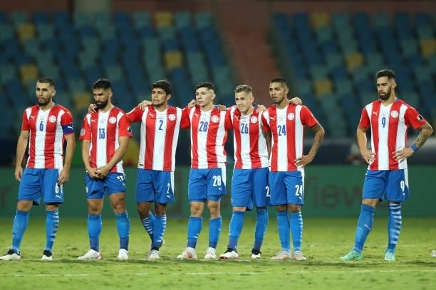 Players of Paraguay react in a penalty shootout after a quarterfinal match between Peru and Paraguay as part of Copa America Brazil 2021 at Estadio...