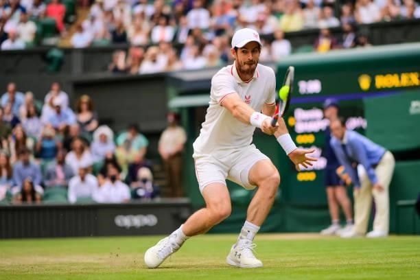 Andy Murray of Great Britain hits a backhand against Dennis Shapovalov of Canada in the third round of the gentlemen's singles during Day Five of The...