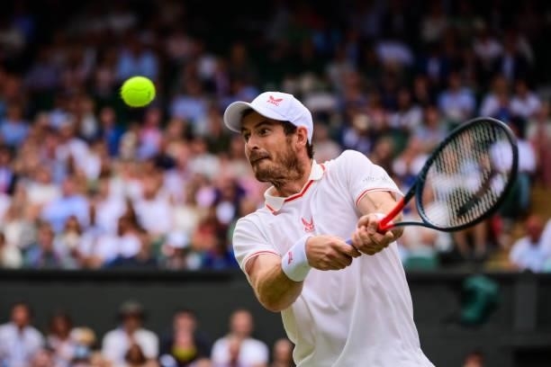 Andy Murray of Great Britain hits a backhand against Dennis Shapovalov of Canada in the third round of the gentlemen's singles during Day Five of The...