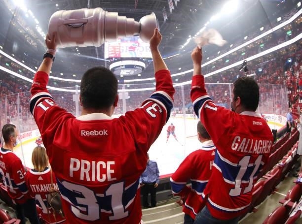 Montreal Canadiens fan wearing a Carey Price Jersey hoists a mock Stanley cup prior to Game Three of the 2021 NHL Stanley Cup Final against the Tampa...