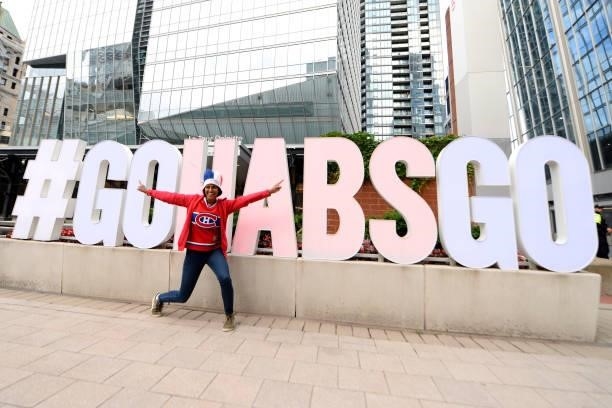 Montreal Canadiens fan poses in from of a Go Habs Go sign prior to Game Three of the 2021 NHL Stanley Cup Final against the Tampa Bay Lightning at...