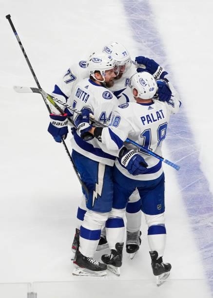 Jan Rutta of the Tampa Bay Lightning celebrates with teammates after scoring against Carey Price of the Montreal Canadiens during the first period in...