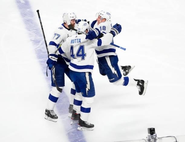 Jan Rutta of the Tampa Bay Lightning celebrates with teammates after scoring against Carey Price of the Montreal Canadiens during the first period in...