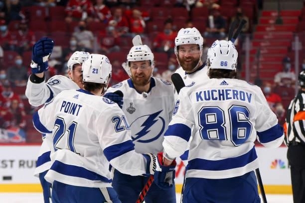 Jan Rutta of the Tampa Bay Lightning celebrates with teammates after scoring against Carey Price of the Montreal Canadiens in the first period of...