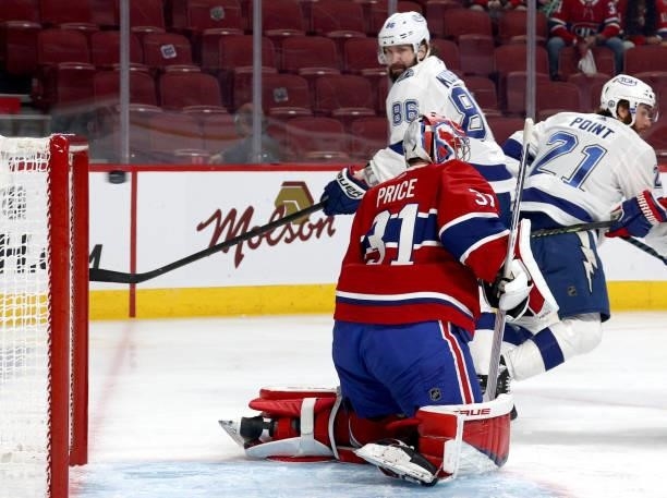 Nikita Kucherov of the Tampa Bay Lightning watches as the puck gets past goaltender Carey Price of the Montreal Canadiens for a goal on a shot by Jan...