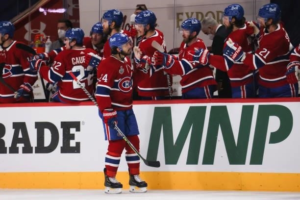Phillip Danault of the Montreal Canadiens celebraters with teammates after scoring against Andrei Vasilevskiy of the Tampa Bay Lightning during the...