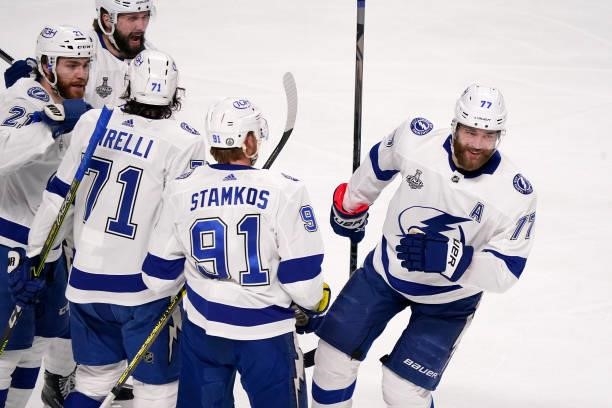 Anthony Cirelli of the Tampa Bay Lightning is congratulated by his teammates after scoring a goal against the Montreal Canadiens during the first...