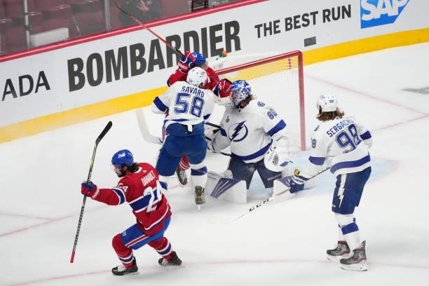 Phillip Danault of the Montreal Canadiens scores a goal past Andrei Vasilevskiy of the Tampa Bay Lightning during the first period in Game Three of...