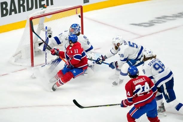 Phillip Danault of the Montreal Canadiens scores a goal past Andrei Vasilevskiy of the Tampa Bay Lightning during the first period in Game Three of...