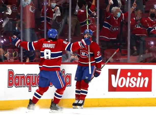 Phillip Danault of the Montreal Canadiens celebrates his goal with teammate Ben Chiarot during the first period of Game Three of the 2021 Stanley Cup...