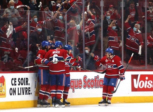 Phillip Danault of the Montreal Canadiens celebrates his goal with teammate Ben Chiarot, Brendan Gallagher and Shea Weber during the first period of...