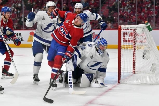 Nick Suzuki of the Montreal Canadiens skates by Andrei Vasilevskiy of the Tampa Bay Lightning during the first period in Game Three of the 2021 NHL...