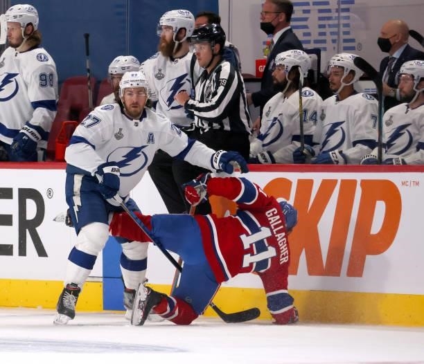 Ryan McDonagh of the Tampa Bay Lightning collides with Brendan Gallagher of the Montreal Canadiens during the first period in Game Three of the 2021...