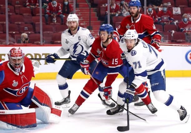 Goaltender Carey Price, Jesperi Kotkaniemi and Joel Edmundson of the Montreal Canadiens defend against Steven Stamkos and Anthony Cirelli of the...