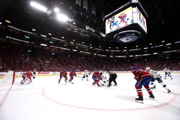 The Montreal Canadiens and the Tampa Bay Lightning face off during the first period of Game Three of the 2021 Stanley Cup Final at Bell Centre on...