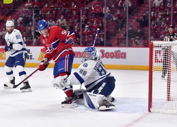 Andrei Vasilevskiy of the Tampa Bay Lightning tends goal against Corey Perry of the Montreal Canadiens during the first period in Game Three of the...