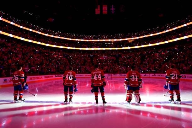 The Montreal Canadiens starting line up stands on the blue line during pregame for Game Three of the 2021 Stanley Cup Final between the Tampa Bay...