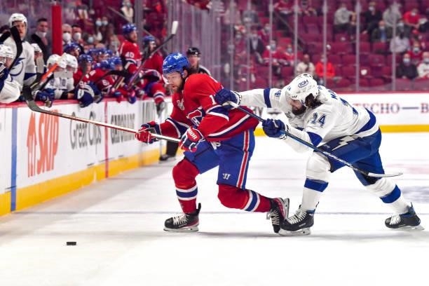 Josh Anderson of the Montreal Canadiens battles for possession against Pat Maroon of the Tampa Bay Lightning during the first period in Game Three of...