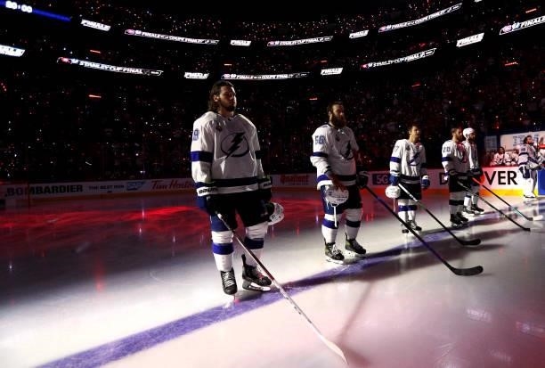 Mikhail Sergachev and the Tampa Bay Lightning starting line up stand on the blue line during pregame for Game Three of the 2021 Stanley Cup Final...