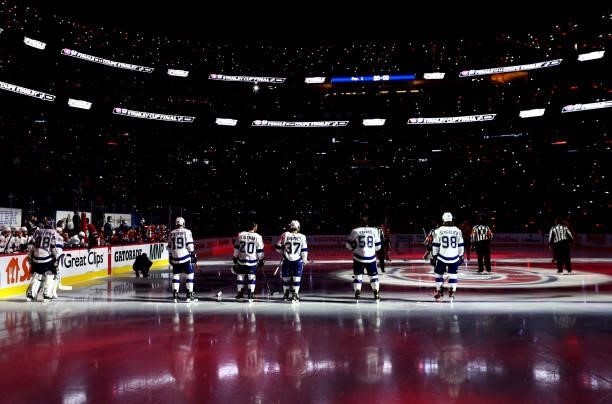 The Tampa Bay Lightning starting line up stands on the blue line during pregame for Game Three of the 2021 Stanley Cup Final between the Tampa Bay...