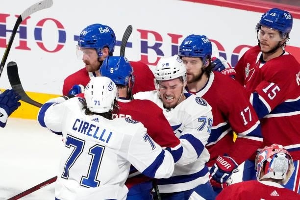 Shea Weber of the Montreal Canadiens fights with Ross Colton of the Tampa Bay Lightning and Anthony Cirelli during the first period in Game Three of...