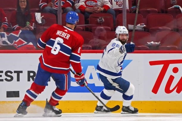 Shea Weber of the Montreal Canadiens looks on as Nikita Kucherov of the Tampa Bay Lightning reacts after scoring against Carey Price during the...