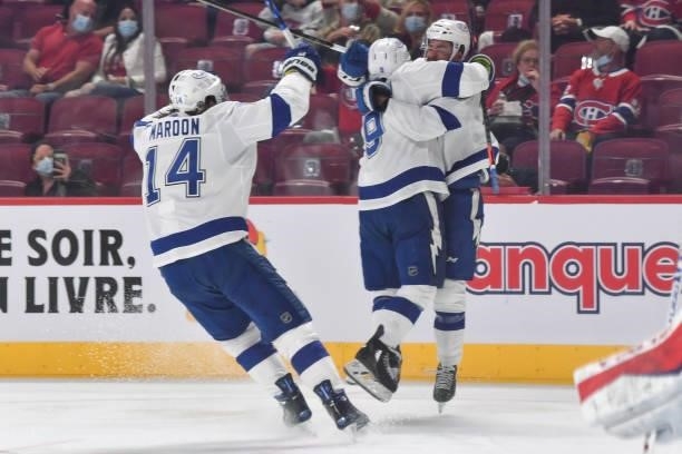 Pat Maroon reacts as Tyler Johnson of the Tampa Bay Lightning celebrates with Mathieu Joseph after scoring against Carey Price of the Montreal...