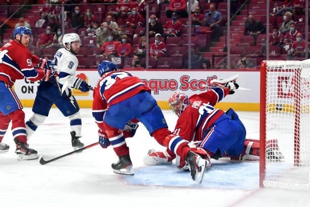 Tyler Johnson of the Tampa Bay Lightning scores against Carey Price of the Montreal Canadiens during the second period in Game Three of the 2021 NHL...