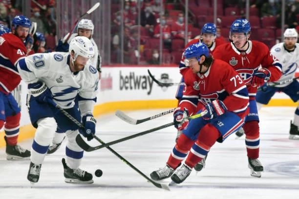Blake Coleman of the Tampa Bay Lightning battles for possession against Tyler Toffoli of the Montreal Canadiens during the second period in Game...