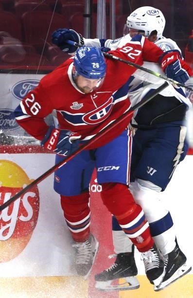 Jeff Petry of the Montreal Canadiens checks Blake Coleman of the Tampa Bay Lightning at the boards during the first period of Game Three of the 2021...