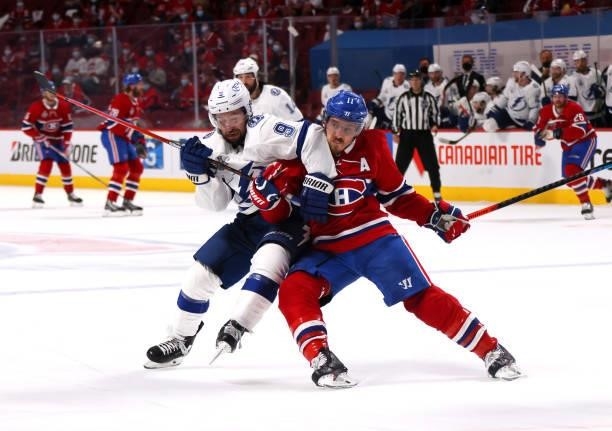 Tyler Johnson of the Tampa Bay Lightning is defended by Brendan Gallagher of the Montreal Canadiens during the second period in Game Three of the...