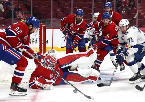 Goaltender Carey Price of the Montreal Canadiens goes down to make a save against the Tampa Bay Lightning during the first period of Game Three of...
