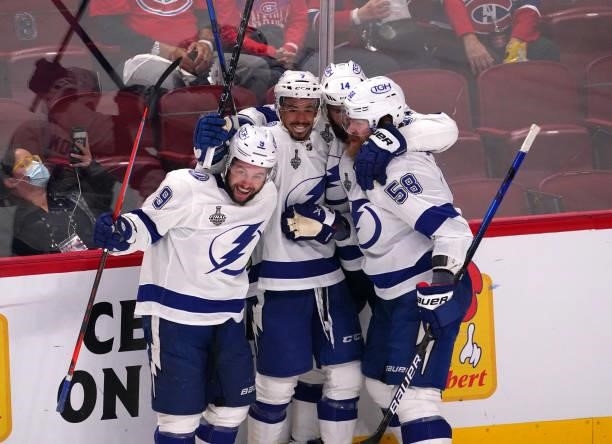 Tyler Johnson of the Tampa Bay Lightning celebrates with teammates after scoring against Carey Price of the Montreal Canadiens during the second...