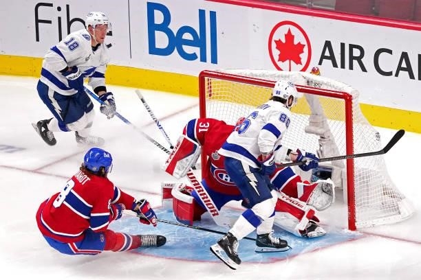 Nikita Kucherov of the Tampa Bay Lightning scores against Carey Price of the Montreal Canadiens during the second period in Game Three of the 2021...