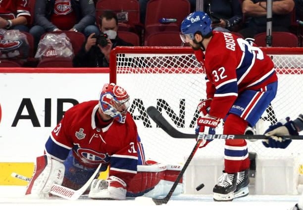 The puck gets past goaltender Carey Price of the Montreal Canadiens on a goal by Tyler Johnson of the Tampa Bay Lightning during the second period of...