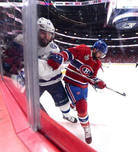 Erik Gustafsson of the Montreal Canadiens checks Pat Maroon of the Tampa Bay Lightning during the second period in Game Three of the 2021 NHL Stanley...