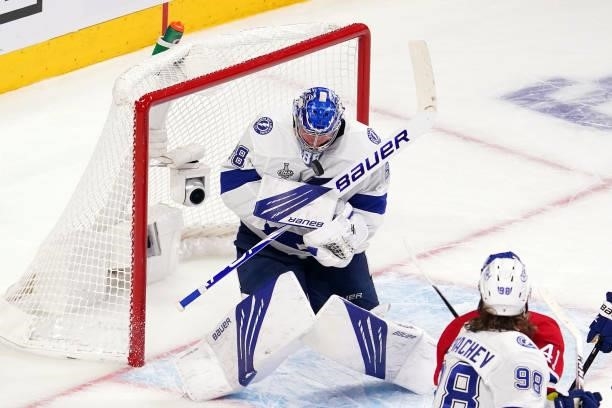 Andrei Vasilevskiy of the Tampa Bay Lightning blocks a shot by the Montreal Canadiens during the second period in Game Three of the 2021 NHL Stanley...