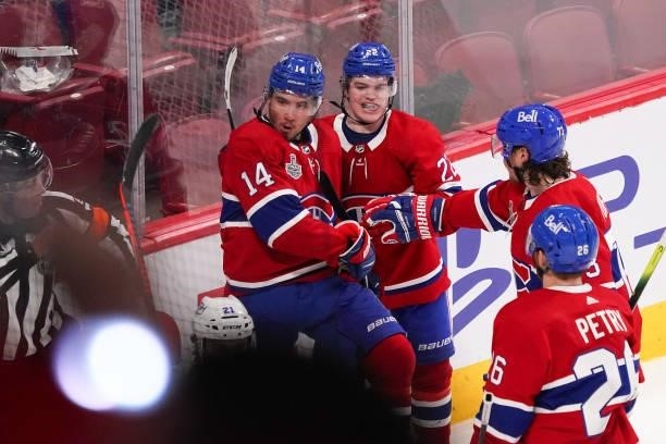 Nick Suzuki of the Montreal Canadiens celebrates with teammates after scoring against Andrei Vasilevskiy of the Tampa Bay Lightning during the second...
