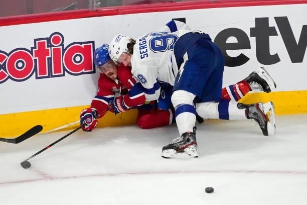 Mikhail Sergachev of the Tampa Bay Lightning checks Brendan Gallagher of the Montreal Canadiens during the second period in Game Three of the 2021...