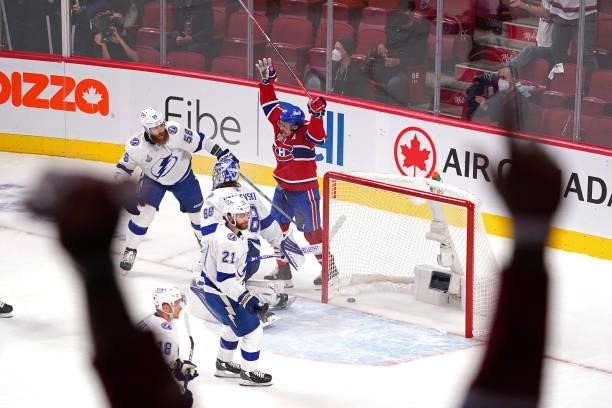 Brendan Gallagher of the Montreal Canadiens celebrates a goal by teammate Phillip Danault past Andrei Vasilevskiy of the Tampa Bay Lightning during...