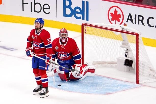 Erik Gustafsson and Carey Price of the Montreal Canadiens react after Tyler Johnson of the Tampa Bay Lightning scored during the second period in...
