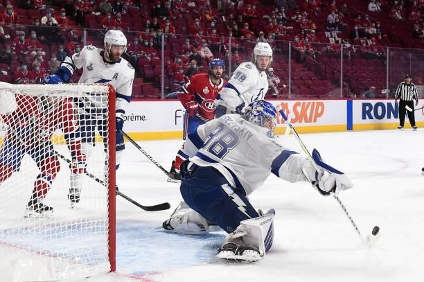 Andrei Vasilevskiy of the Tampa Bay Lightning makes the save against the Montreal Canadiens during the second period in Game Three of the 2021 NHL...